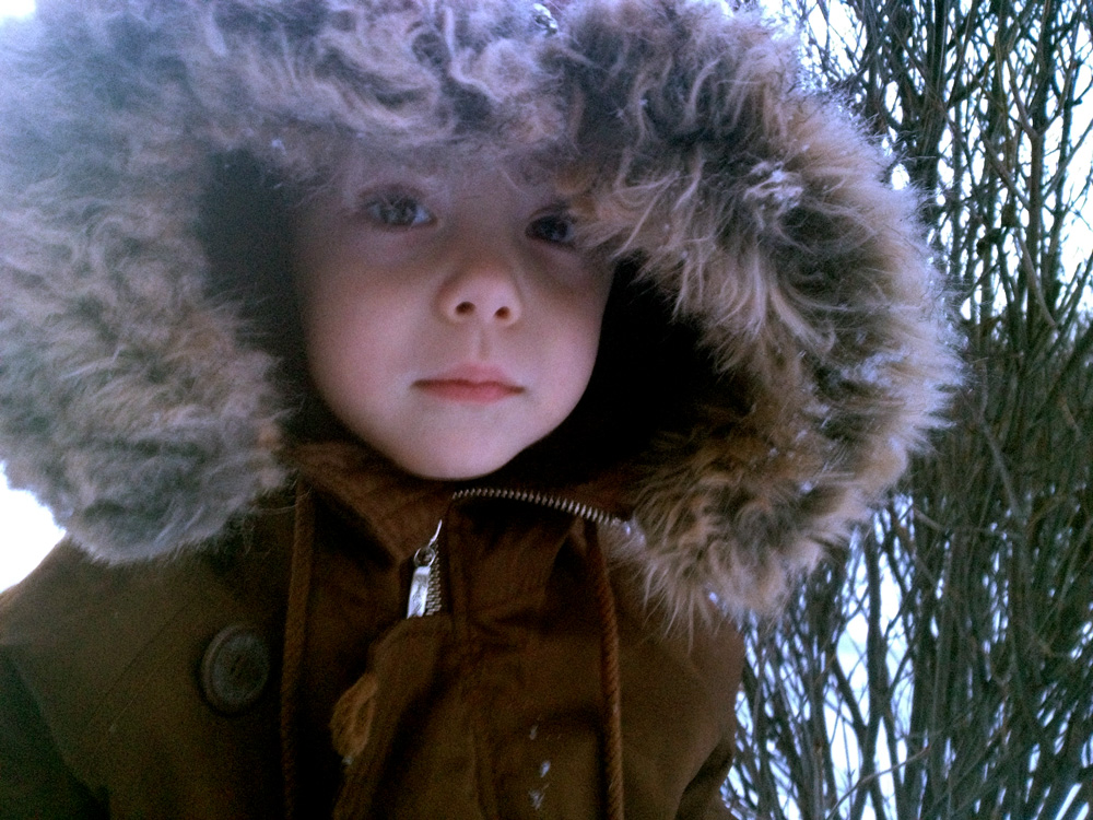 color corrected photo of young boy in parka.