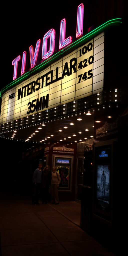 Photo of Tivoli movie theater and its marquee. Too dark, details lost.